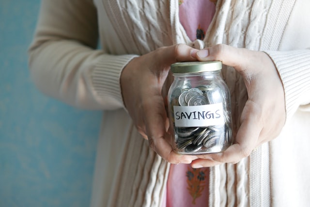 coin jar labeled "savings"